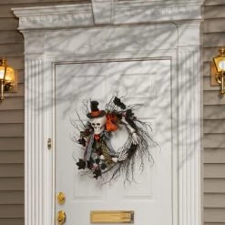 National Tree Company Artificial Skeleton's Halloween Wreath, Decorated with Branches, Orange and Black Trim, Berry Clusters, Assorted Leaves, 24 in
