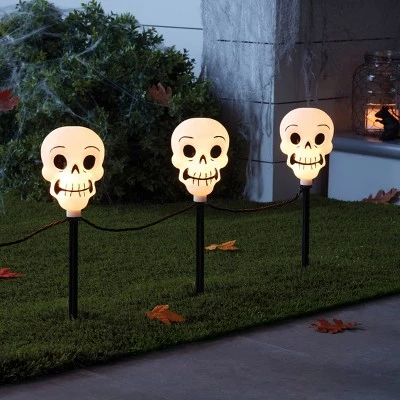 Hyde & EEK! Boutique 5ct Incandescent Clear Skull Halloween Pathway Stake Lights - Hyde & EEK! Boutique™ 1 Hyde & EEK! Boutique 5ct Incandescent Clear Skull Halloween Pathway Stake Lights - Hyde & EEK! Boutique™